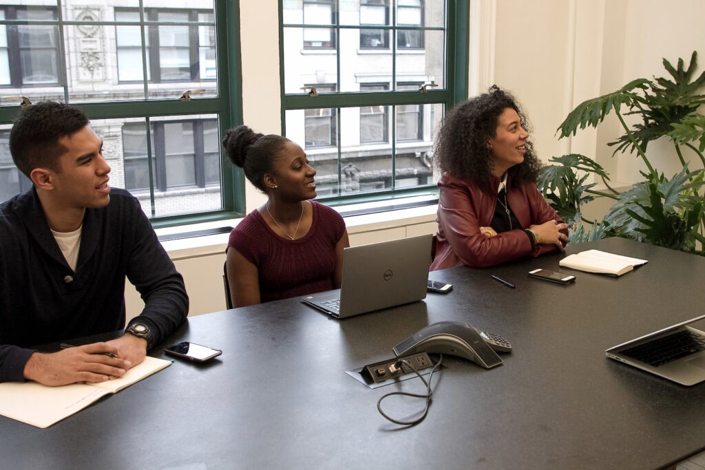 a group of people sitting around a table